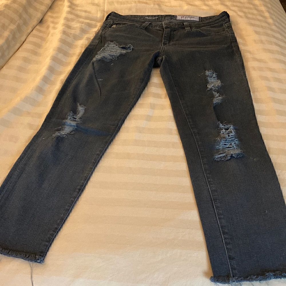 AG Denim The Stilt Crop Cigarette Crop in Black with Shredded Front Legs.